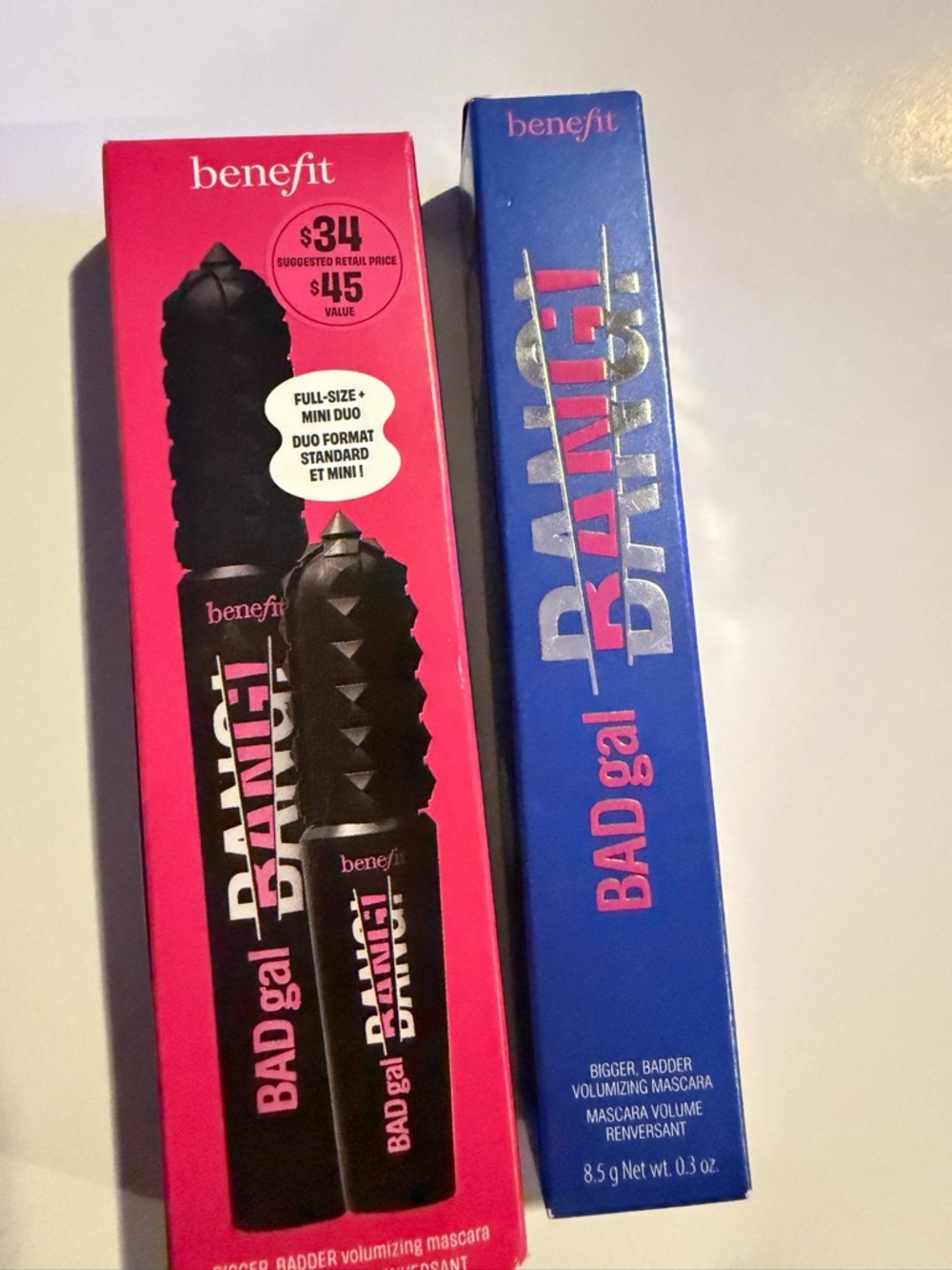 Benefit mascara packaging in pink and blue with black label